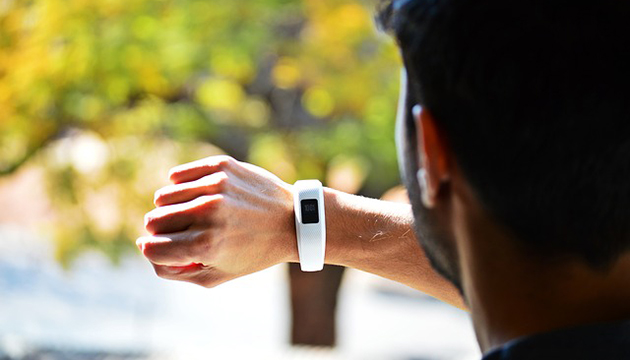 The MIT researchers' prototype for a chip measuring 3 millimeters by 3 millimeters. The magnified detail shows the chip's main control circuitry, including the startup electronics; the controller that determines whether to charge the battery, power a device, or both; and the array of switches that control current flow to an external inductor coil. This active area measures just 2.2 millimeters by 1.1 millimeters.