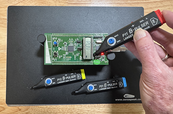 Figure 7: Using the H-field injector on an embedded processor. I was able to change the modes on this demonstrator board near one of the processor pins; otherwise, it was relatively immune.