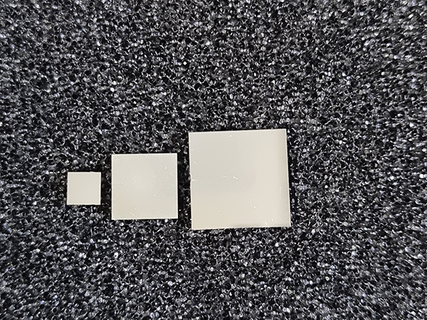 Figure 6: Fully metallized dies used as DUTs during the discharge test in laboratory environment with the DUT edge length (from the left) 5 mm, 10 mm, and 15mm.